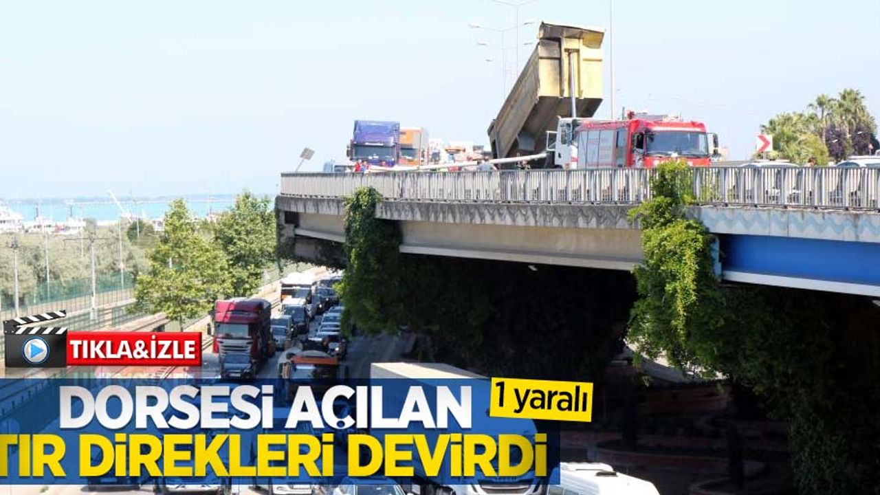 Dorsesi açılan tır direkleri devirdi: 1 yaralı