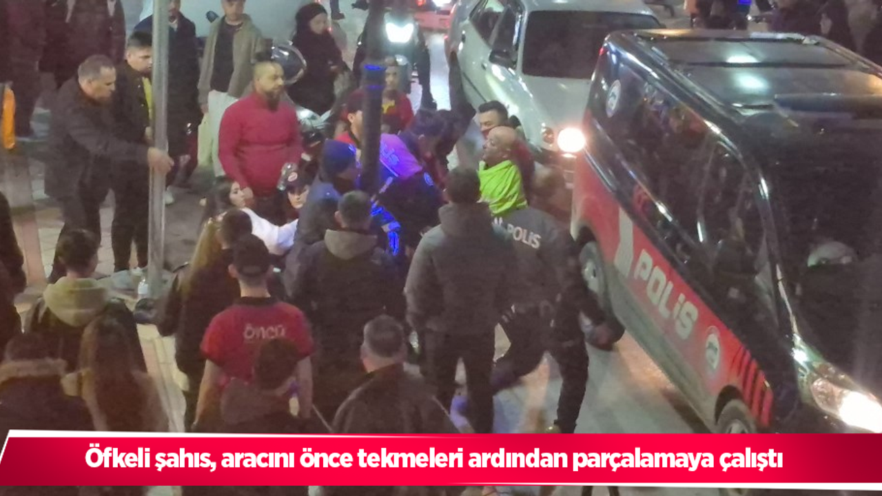 Öfkeli şahıs, aracını önce tekmeleri ardından parçalamaya çalıştı