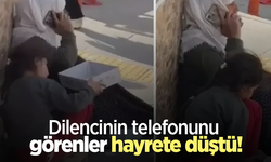 Dilencinin telefonunu görenler hayrete düştü