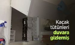 Kaçak tütünleri duvara gizlemiş