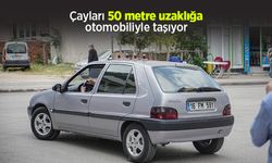 Çayları 50 metre uzaklığa otomobiliyle taşıyor