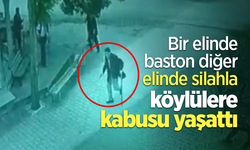 Bir elinde baston diğer elinde silahla köylülere kabusu yaşattı