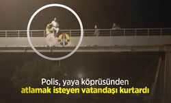 Polis, yaya köprüsünden atlamak isteyen vatandaşı kurtardı