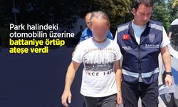 Park halindeki otomobilin üzerine battaniye örtüp ateşe verdi