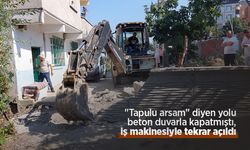 "Tapulu arsam" diyen yolu beton duvarla kapatmıştı, iş makinesiyle tekrar açıldı