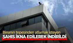 Binanın tepesinden atlamak isteyen şahıs ikna edilerek indirildi