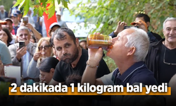 2 dakikada 1 kilogram bal yedi.
