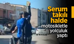 Serum takılı halde motosikletle yolculuk yaptı.