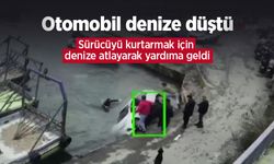 Otomobil denize düştü: Sürücüyü kurtarmak için denize atlayarak yardıma geldi