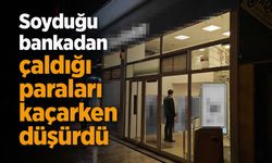 Soyduğu bankadan çaldığı paraları kaçarken düşürdü