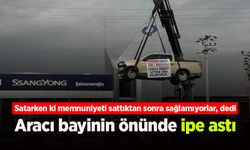Aracını bayinin önünde ipe astı