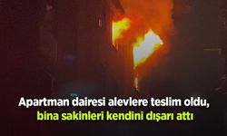 Apartman dairesi alevlere teslim oldu, bina sakinleri kendini dışarı attı