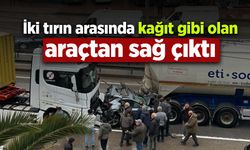 İki tırın arasında kağıt gibi olan araçtan sağ çıktı