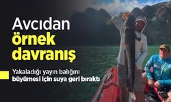 Avcıdan örnek davranış: Yakaladığı yayın balığını büyümesi için suya geri bıraktı
