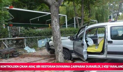 Kontrolden çıkan araç bir restoran duvarına çarparak durabildi, 2 kişi yaralandı