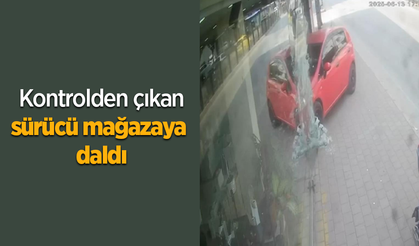 Kontrolden çıkan sürücü mağazaya daldı