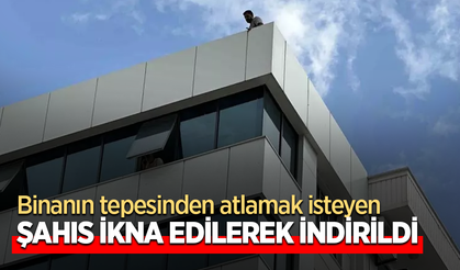 Binanın tepesinden atlamak isteyen şahıs ikna edilerek indirildi