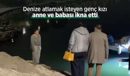 Denize atlamak isteyen genç kızı anne ve babası ikna etti