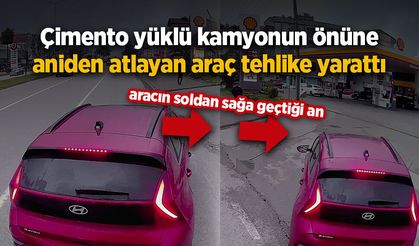 Çimento yüklü kamyonun önüne aniden atlayan araç tahlike yarattı