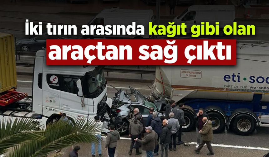 İki tırın arasında kağıt gibi olan araçtan sağ çıktı